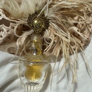 Gold and Clear Perfume Bottle with Feather Accent